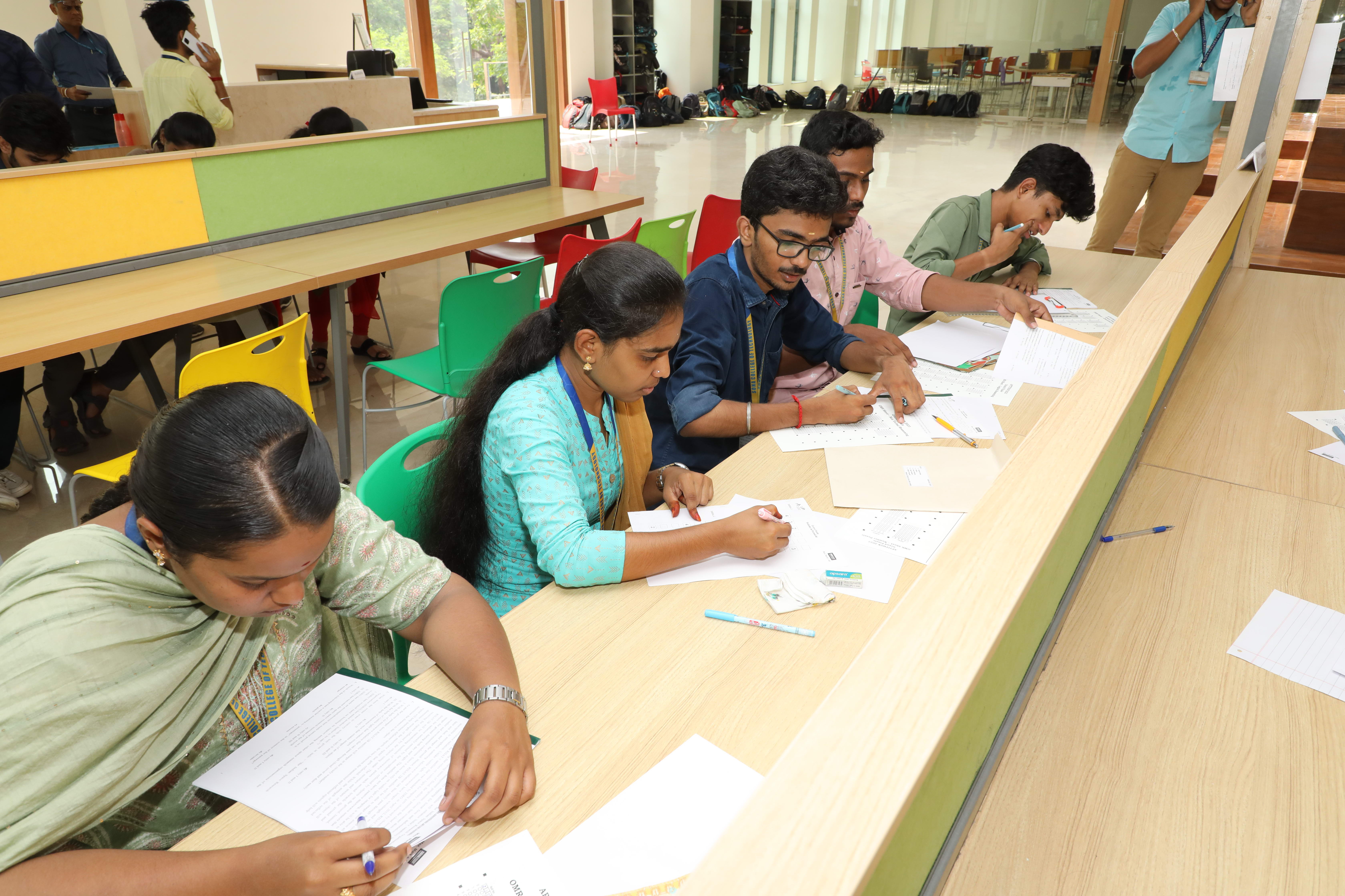 Low angle view up into a sky filled with deep blue clouds.